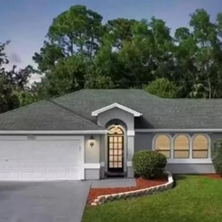 Buy this 4 bed house on 1949 Southwest Swift Avenue in Port Saint Lucie, FL 34953