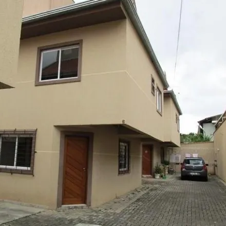 Rent this 3 bed house on Rua Amoraas 48 in Uberaba, Curitiba - PR