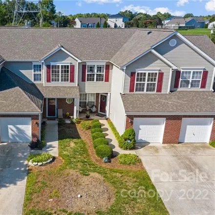 Buy this 2 bed townhouse on 8500 Carolina Lily Lane in Withrow Downs, NC 28262