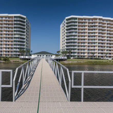 Buy this 3 bed condo on 6500 Dolphin Pointe Drive in Upper Grand Lagoon, FL 32407