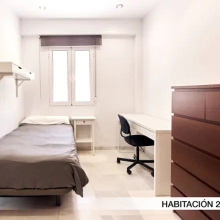 Rent this 2 bed room on Calle Virgen del Refugio in 48, 41010 Seville