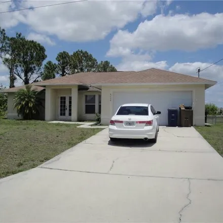 Rent this 3 bed house on 4206 34th Street Southwest in Lehigh Acres, FL 33973