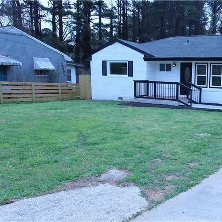 Buy this 4 bed house on 2686 Tilson Road in Candler-McAfee, GA 30032