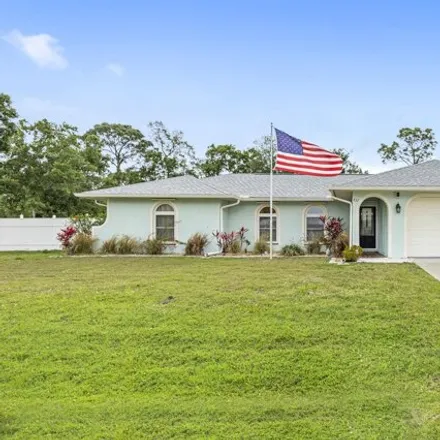 Buy this 4 bed house on 441 Narragansett Street Northeast in Palm Bay, FL 32907