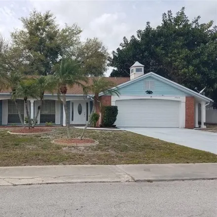 Rent this 3 bed house on 3611 Edenwood Drive in Beacon Square, Pasco County