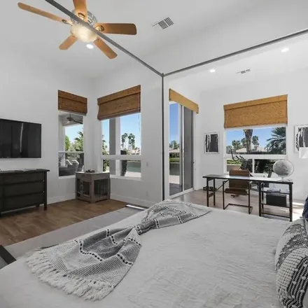 Rent this 4 bed apartment on 56714 Muirfield Village in La Quinta, CA 92253