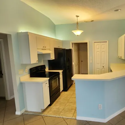 Rent this 3 bed house on 4220 Southwest Jarmer Road in Port Saint Lucie, FL 34953