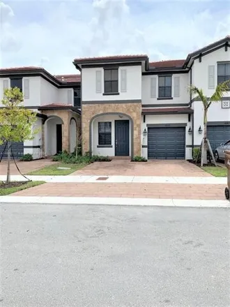 Rent this 4 bed townhouse on 10319 West 33rd Way in Hialeah, FL 33018