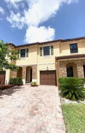 Rent this 3 bed townhouse on Southwest 117th Avenue in Miami-Dade County, FL 33039