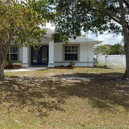 Buy this 3 bed house on 1418 Southwest Sudder Avenue in Port Saint Lucie, FL 34953