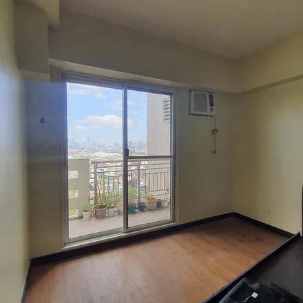 Rent this 2 bed apartment on South Zinnia Tower in Zinnia Road, Katipunan