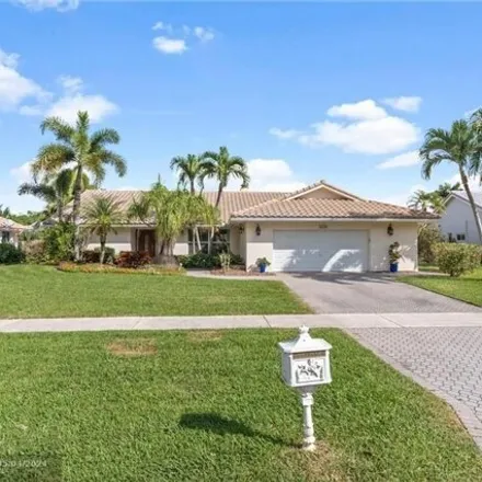 Rent this 3 bed house on 2449 Lakes Drive in Deerfield Beach, FL 33442