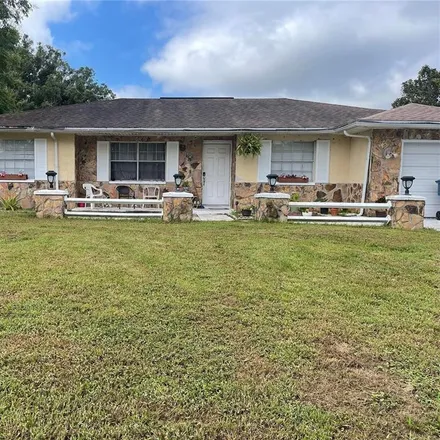 Buy this 4 bed house on 1127 Lodge Circle in Spring Hill, FL 34606