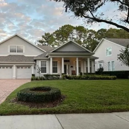 Rent this 5 bed house on 8449 Woburn Court in Orange County, FL 34786