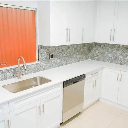 Rent this 3 bed apartment on 4754 Northwest 4th Street in Miami, FL 33126