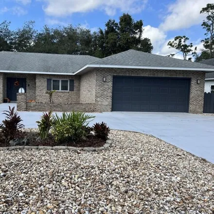 Rent this 3 bed house on 41 Lazy Eight Drive in Port Orange, FL 32128