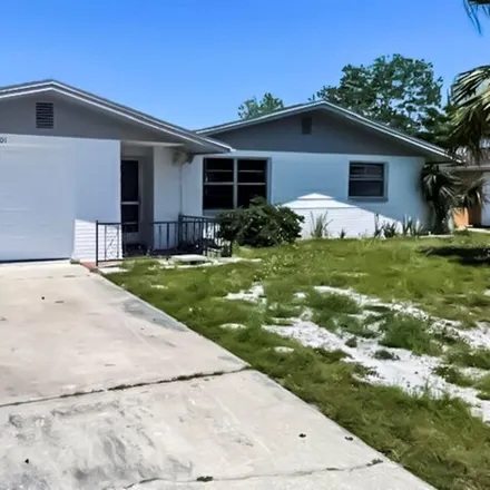 Rent this 3 bed house on 7275 Robstown Drive in Jasmine Estates, FL 34668