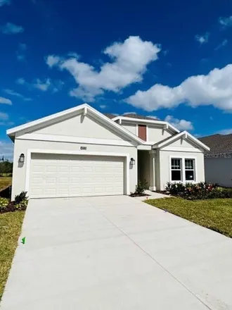 Rent this 4 bed house on 4223 Little Owl Ln in Kissimmee, Florida