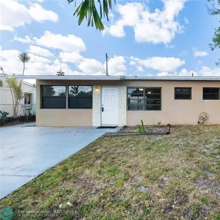 Buy this 3 bed house on 383 Northeast 58th Street in Broward County, FL 33334
