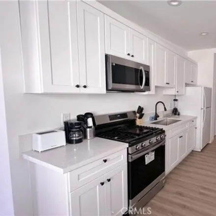 Rent this 3 bed apartment on 1481 South Cloverdale Avenue in Los Angeles, CA 90019