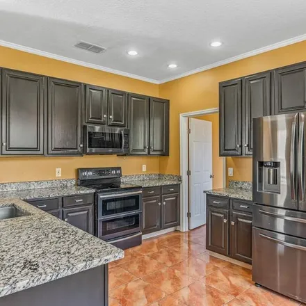 Rent this 5 bed apartment on 8486 Diamond Cove Circle in Doctor Phillips, FL 32836