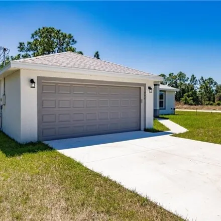 Rent this 3 bed house on 599 Wabasso Avenue in Lehigh Acres, FL 33974