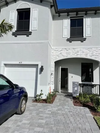 Buy this 4 bed townhouse on unnamed road in Andover Golf Estates, Miami Gardens