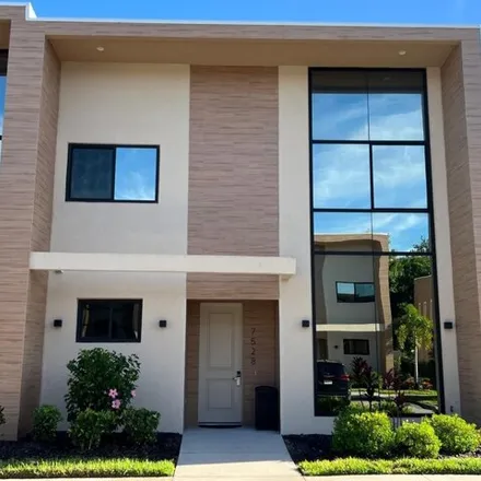 Buy this 4 bed townhouse on 7528 Brooklyn Dr in Kissimmee, Florida