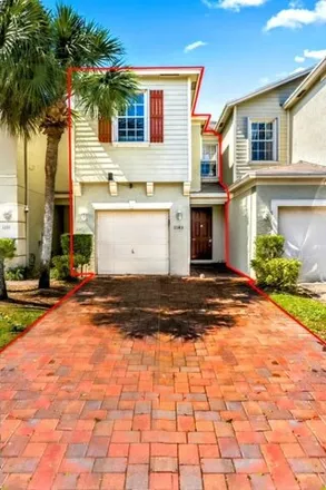 Buy this 3 bed townhouse on 1129 Sweet Violet Court in Palm Beach County, FL 33415