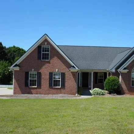 Buy this 4 bed house on 1427 Shiloh Oak Dr in Loganville, Georgia