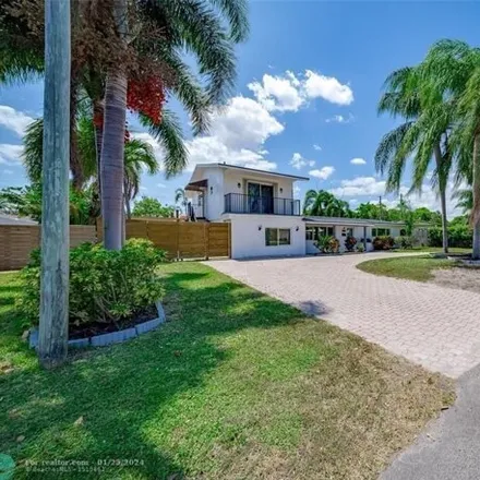 Rent this 5 bed house on 853 Northeast 23rd Terrace in Harbor Village, Pompano Beach