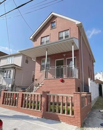 Buy this 6 bed townhouse on 119-07 28th Avenue in New York, NY 11354