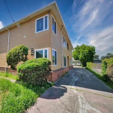 Buy this 8 bed house on 9711;9715;9717;9719 Walnut Street in Oakland, CA 94621