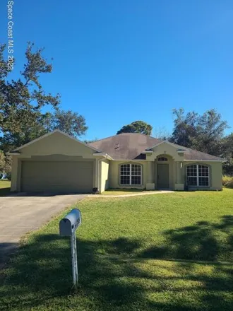 Rent this 4 bed house on 153 Battersea Avenue Northeast in Palm Bay, FL 32907
