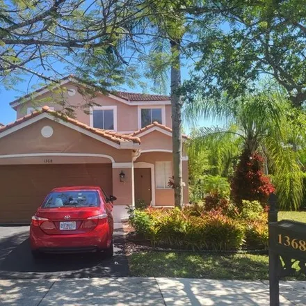 Rent this 4 bed house on 1368 Majesty Terrace in Weston, FL 33327