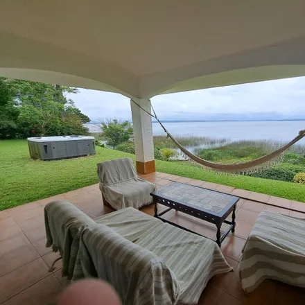 Rent this 3 bed house on Rambla Lago de Baygorria in 20003 Punta Ballena, Uruguay