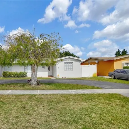Buy this 5 bed house on 3635 Northwest 28th Street in Golf Estates, Lauderdale Lakes