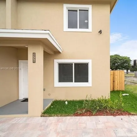 Rent this 4 bed townhouse on 1780 Northwest 55th Street in Liberty Square, Miami