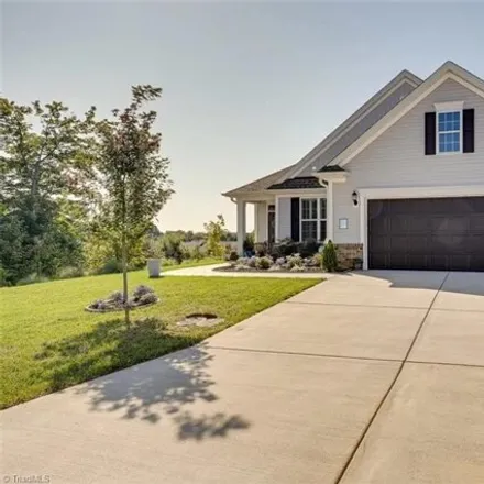 Buy this 4 bed house on Woodside Forest Trail in Lewisville, NC 27023
