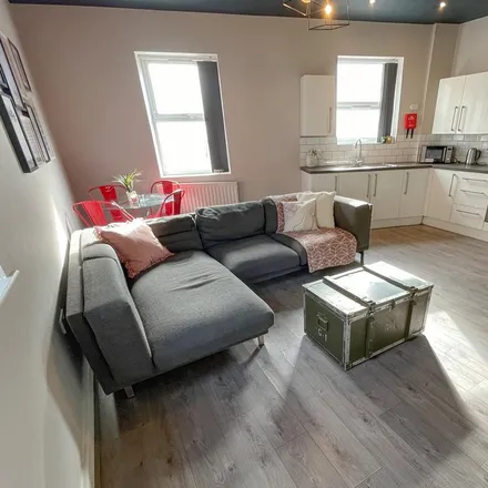 Rent this 8 bed townhouse on Tony's Fish & Chips in Holt Road, Liverpool