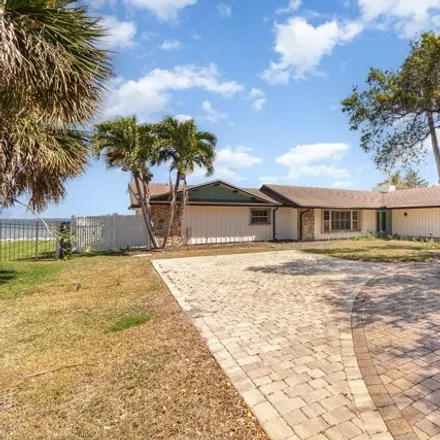 Rent this 4 bed house on 8044 South Tropical Trail in Fairyland, Brevard County