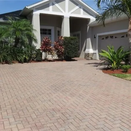 Rent this 4 bed house on 7331 Chelsea Harbour Drive in Orlando, FL 32829