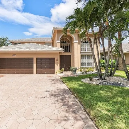 Buy this 4 bed house on 5863 54th Circle in Coral Springs, FL 33067
