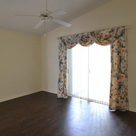 Rent this 3 bed apartment on 2013 Southwest Olympic Club Terrace in Palm City, FL 34990