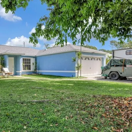 Buy this 3 bed house on 2297 Southwest Kenwick Avenue in Port Saint Lucie, FL 34953