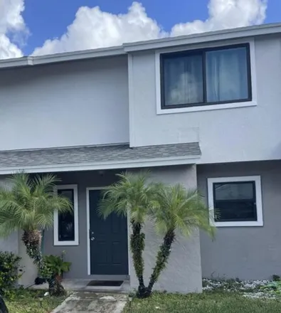 Rent this 2 bed townhouse on Poolside Drive in Greenacres, FL 33463