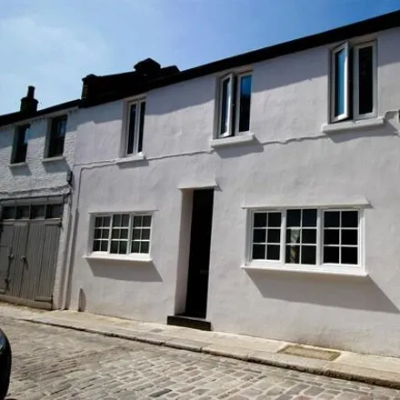 Rent this 3 bed townhouse on Camden Mews in London, NW1 9AG