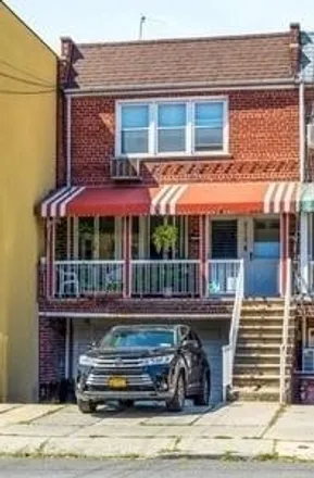 Buy this 6 bed townhouse on 8760 25th Avenue in New York, NY 11214