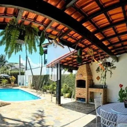 Buy this 4 bed house on Rua José D’Ameida Barbosa in Pontal Santa Marina, Caraguatatuba - SP