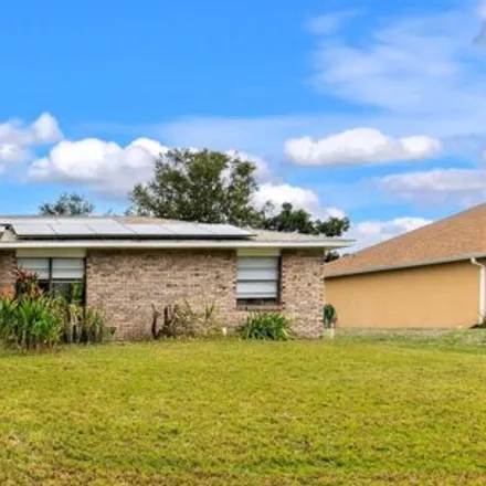 Buy this 3 bed house on 809 Beacon Street Northwest in Palm Bay, FL 32907